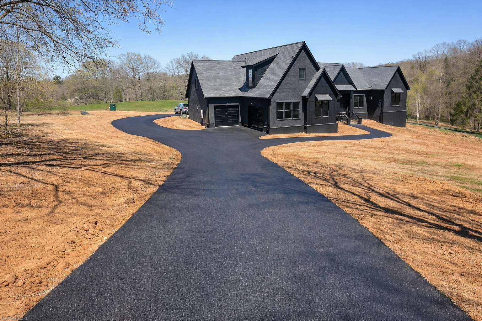 New asphalt driveway installation at a home in Columbia Tennessee